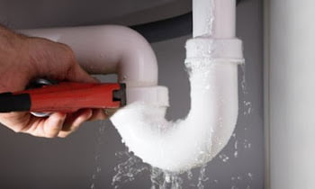 Why is the sewer pipe leaking in the basement?