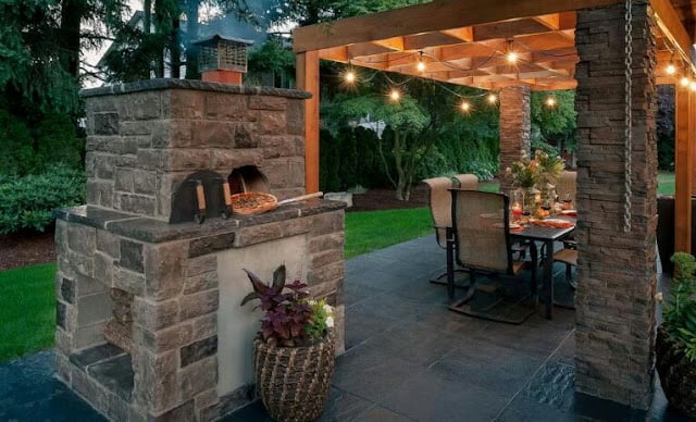 covered outdoor living spaces with fireplace