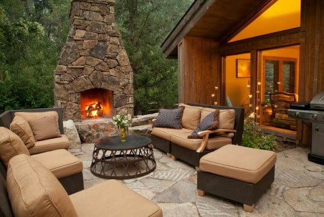 covered outdoor living spaces with fireplace
