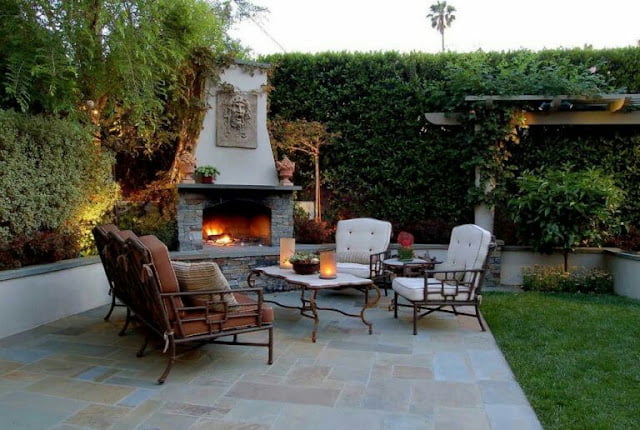 covered outdoor living spaces with fireplace
