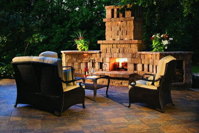 covered outdoor living spaces with fireplace