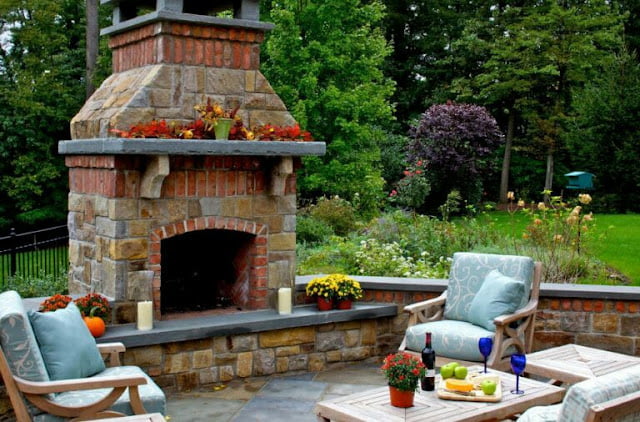 covered outdoor living spaces with fireplace