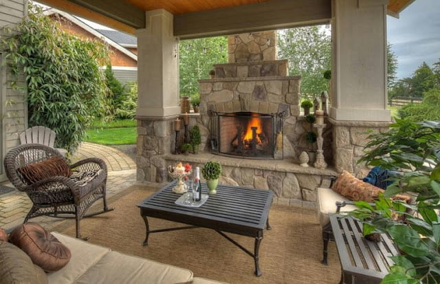 covered outdoor living spaces with fireplace