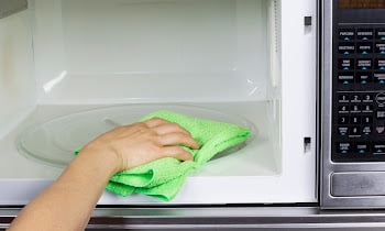 How to get rid of burnt popcorn smell in microwave